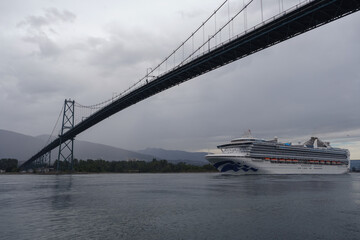 Modern Princess cruiseship cruise ship liner Grand set sail away from Vancouver, Canada port on cloudy day with light rain before Alaska cruise British Columbia
