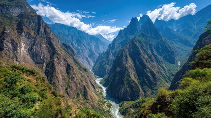 Obraz premium Mountainous gorge with river. Lush vegetation flanks the steep cliffs