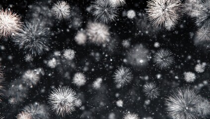 Abstract, monochrome, firework-like bursts on a dark background