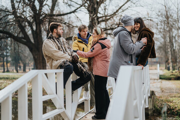 A joyful gathering of friends interacting and enjoying an outdoor day at a scenic park. The group is sharing moments of connection while standing on a white bridge surrounded by peaceful nature.
