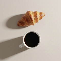 Coffee and croissant flat lay. Minimalist breakfast with a fresh pastry and a mug of black coffee on a beige background.