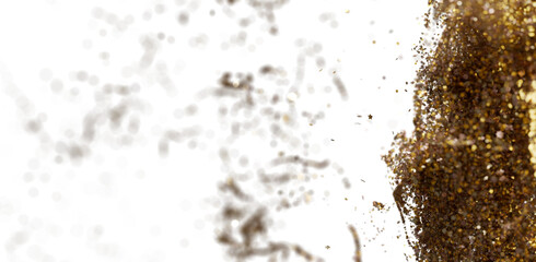 Abstract image of gold glitter exploding on white background. Perfect for celebratory designs.