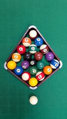 Ultra realistic close-up of a glossy black 8-ball reflecting overhead lights, set on a green felt pool table, shallow depth of field, cinematic lighting