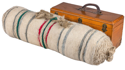 Vintage burlap roll with colorful twine and wooden box for storage and decor in rustic home or workshop