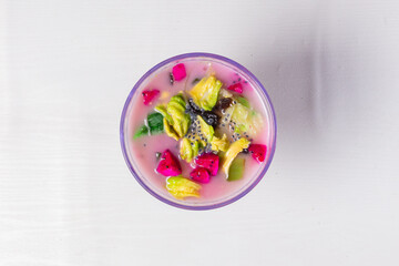 Colorful Sop Buah in Bowl - Traditional Indonesian Fruit Drink. Isolated in White Background