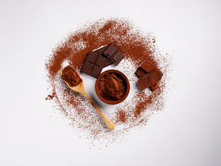 Chocolate and finely ground powder on a white background