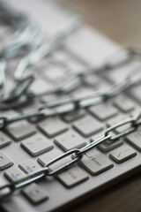 Keyboard with Chain: Cybersecurity, Data Protection, and Information Security Concept