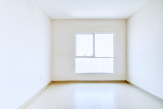 Clean unfurnished apartment interior showcasing spacious layout, raw architectural details, and abundant natural light. Ideal for real estate listings. Series.