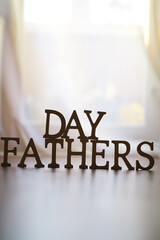 ** Father's Day Celebration Display - Wooden Letters with Soft Lighting in Background