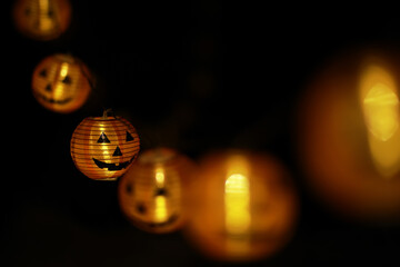 Halloween Jack-o'-Lantern String Lights in Dark Background for Spooky Seasonal Decoration