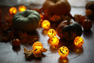Festive Halloween Pumpkin Decoration with Glowing Jack-o'-Lantern String Lights in Autumn Setting