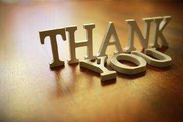 Naklejka na ściany i meble Thank You Message in 3D Letters on Wooden Surface - Gratitude, Appreciation, and Acknowledgment Concept