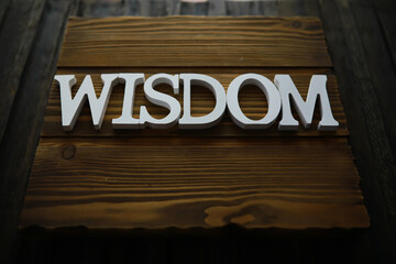 WISDOM Wooden Sign on Rustic Wooden Background - Inspirational Home Decor