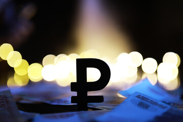Silhouetted Ruble Symbol with Currency Notes and Bright Bokeh Backgrounds - Financial Concept