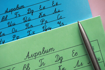 Learning Cyrillic Alphabet: Handwriting Practice and Cursive on Blue and Green Paper with Silver Pen