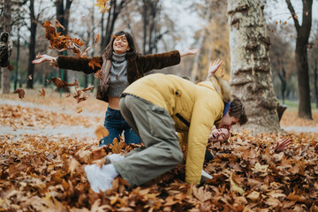 Group of friends having fun outdoors during fall, captured while enjoying the crisp air and fallen autumn leaves in a vibrant park atmosphere, radiating joy, playfulness, and togetherness.
