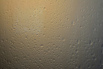 Water droplet texture on glass surface with soft light