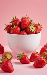 Fresh Strawberries in a White Bowl Against a Pink Background