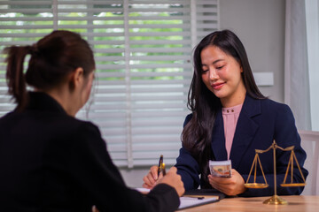 In the company's law office, a businessman secretly hands over dollar bills with contracts,...
