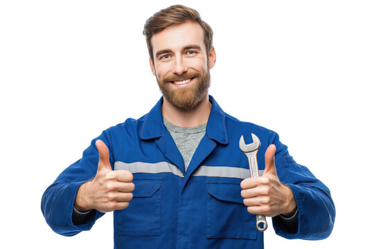 Smiling mechanic in blue uniform holding wrench and giving thumbs up isolated on a transparent background