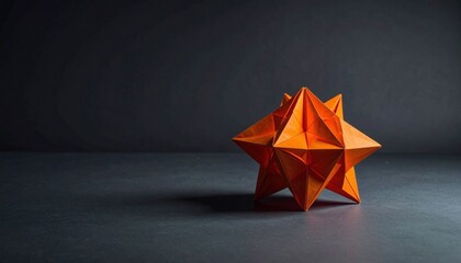 Orange Origami Star Shaped Geometric Model On Dark Background