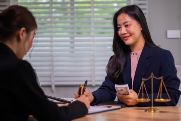 In the company's law office, a businessman secretly hands over dollar bills with contracts,...