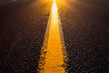 Yellow marking line painted on the road