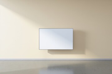 Minimalist interior with a blank white canvas on a beige wall and soft natural light