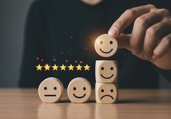 Positive user experience: a hand carefully positioning a wooden happy face for excellent feedback.