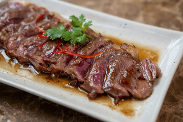 Medium rare sliced fried meat on  plate