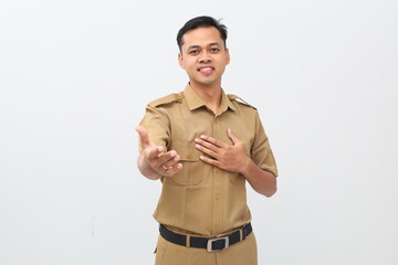 Friendly indonesian government employee standing while offering hand