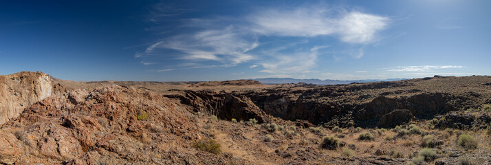 Nevada Desert Rocky Canyon Panorama with Sparse Vegetation and Blue Sky