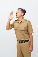 Indonesian civil servant man standing while shouting or announcing something