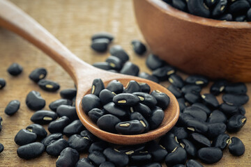 Black bean on wooden spoon