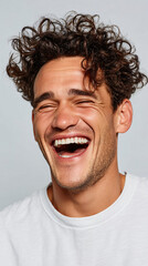 Authentic Joyful Mid‑Laughter Headshot on Off‑White Background for Happiness Ads