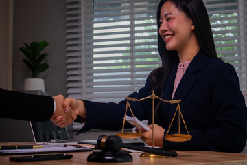 In the company's law office, a businessman secretly hands over dollar bills with contracts,...