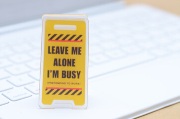 Tiny Humorous Office Sign – Leave Me Alone I'm Busy – Symbol of Workplace Distraction and Fake Productivity