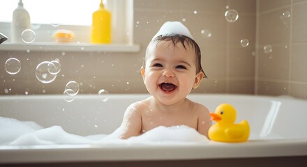 Little baby on bath tub playing 