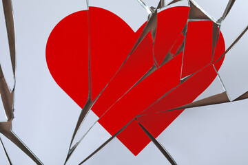Betrayal. Broken glass with red heart, top view