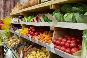 shopping row in a vegetable store. fruits and vegetables in trade