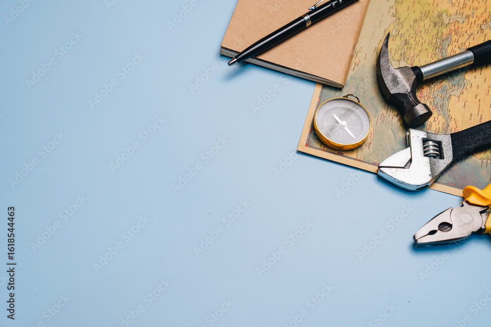 Poster tools and notebook on blue background for planning projects