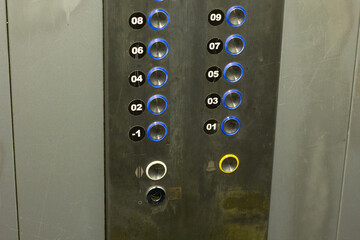 photos of elevator buttons in an apartment building with neutral colors © Вероника