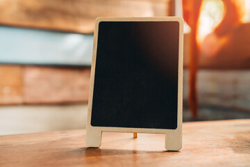 Blank Wooden Chalkboard Stand on Rustic Table Background