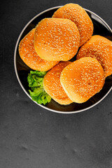 Bun burger puffy soft buns baking fresh delicious gourmet food background on the table rustic food...