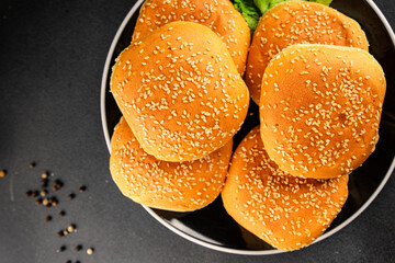 Bun burger puffy soft buns baking fresh delicious gourmet food background on the table rustic food...