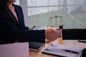 In the company's law office, a businessman secretly hands over dollar bills with contracts,...