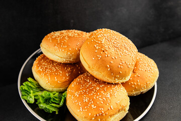 Bun burger puffy soft buns baking fresh delicious gourmet food background on the table rustic food top view copy space