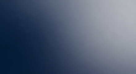 A gradient of dark blue smoothly transitions into a light gray, creating a serene, calming visual