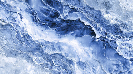 Obraz premium A high-resolution texture of deep blue marble with white veins, showcasing the intricate patterns and natural beauty in an overhead view