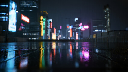 Wet city street at night reflects vibrant neon lights of buildings